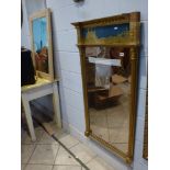 A good Regency giltwood pier glass, with bevelled edge plate below a verre eglomise panel