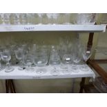 A large quantity of drinking glasses including Cumbria crystal wine glasses, plus further wine