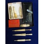 A collection of vintage and antique sewing items, including three bone needle cases of umbrella form