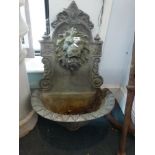 A lead lion head wall mounted recirculating garden fountain [hall] WE DO NOT ACCEPT CREDIT CARDS.