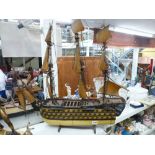 A large wooden model ship on stand with sails and cannons. [s37] WE DO NOT ACCEPT CREDIT CARDS.