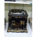 An impressive Victorian inlaid and painted papier-mache cabinet with workbox beneath the hinged