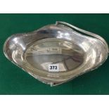 A shaped oval silver basket with scroll rim and swing handle, Sheffield 1916, 17.4 ozt WE DO NOT