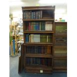 A five-section oak bookcase by Globe Wernicke above a drawered base. WE DO NOT ACCEPT CREDIT