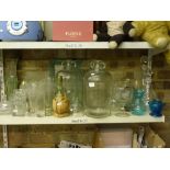 A quantity of domestic glassware that includes glass demi johns, vases, decanter and stopper,