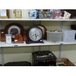 A collection of clocks and movements, comprising: a Smiths mantel clock in brown Bakelite case; a