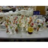 An extensive selection of various first edition Coalport figures and groups of the Snowman including