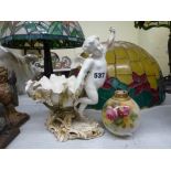 A Victorian Moore porcelain sweetmeat dish applied with orchids and flanked by a cherub in flight,