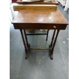 A Victorian walnut sewing table, the rectangular top above a frieze drawer on four turned column