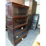 A Globe Wernicke four-section bookcase above a drawer in mahogany. WE DO NOT ACCEPT CREDIT CARDS.