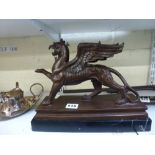 A modern bronze figure of a griffin on marble base, 30 cm long [B] WE DO NOT ACCEPT CREDIT CARDS.