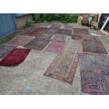 18 Eastern rugs, in different sizes, including a kelim and a runner, probably late 19th to early