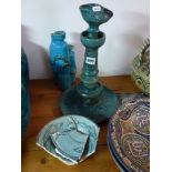 An old Persian turquoise-glazed pottery oil lamp on turned stem with incised decoration; a