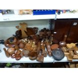 A large lot of wooden ware including ebony elephants, carved wooden animals such as lions,
