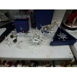 Ten decorative items of Swarovski silver crystal, including some with coloured decoration or metal