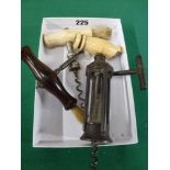 Three antique corkscrews, comprising: steel ratchet with bone handle; T-shape signed Farrow &