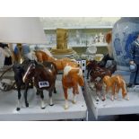 A collection of horses including Beswick brown mares, plus black matt glazed ponies, etc. [s13 &