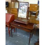 A handsome George III mahogany games table the hinged top on ring-turned gate-leg supports with