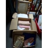 Two boxes of assorted table linen, a vintage wedding dress, veil etc., and a blue crepe de chine