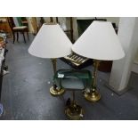 A pair of brushed metal table-lamps and shades and a brass desk lamp with green shade; together with