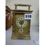A French carriage alarm timepiece, late 19th century, with pale yellow ring dials to the frosted