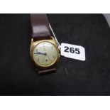 A vintage Tudor man's wrist watch, in 9 ct gold case of rounded square form by Stolkace, dial and