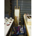 A large quantity of artist equipment and materials comprising of many brushes, easels, paint sets,