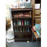 A Globe Wernicke-style oak bookcase of four sections above a drawer. WE DO NOT ACCEPT CREDIT