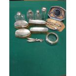 English silver-mounted items, 19th to early 20th century, comprising: three glass scent bottles, a