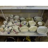 A collection of various Portmeirion pottery items including small chamber pots, coffee cans,