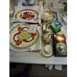 An interesting collection of commemorative art deco and Clarice Cliff design porcelain that includes