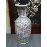 A late 19th century Chinese Canton famille rose porcelain ovoid vase, typically decorated with