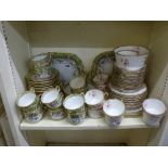 A mid 19th century English bone china part tea service, with flowers, green and gold borders; and an