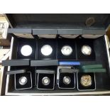 Six one ounce silver Crowns, a silver £5 coin, two silver £2 coin, all mint and in sealed packs,