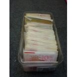 A Perspex box containing unused Royal Mail 1st, 2nd class and non-generic stamps in retail booklets,