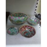 Four Chinese eggshell porcelain famille rose bowls, in sizes, enamelled with dragons and flowers,