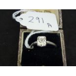 A single-stone diamond ring, the old cushion-cut stone of approximately 1.25 ct, in a 1930s square