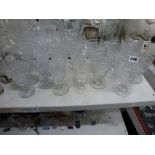 An assembled early 19th century service of drinking glasses, richly cut, comprising: 7 rummers, 4