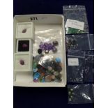 A large quantity of loose gemstones in seven packets, including diamonds, emeralds, amethysts,
