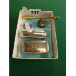 Silver trinkets, comprising: a Tiffany & Co silver dog tag; a cylindrical box by Garrard & Co; a box