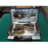 A fine early 20th century silver and tortoiseshell dressing table set, in fitted case lined with