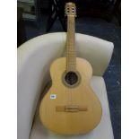 A Hokada Silver classical guitar with label inside. WE DO NOT ACCEPT CREDIT CARDS. CLEARANCE