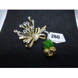 Two vintage costume brooches, one of exuberant ribbon bow and pin form, in gilt metal and crystal,