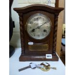 A German mantel clock in oak case, gong-striking, with applied presentation plaque dated 1925 [A] WE