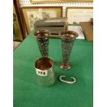 A pair of Edwardian pierced silver vases, each on loaded base, Birmingham 1904, and a silver child's