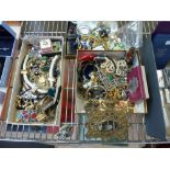 A good selection of costume jewellery in three cartons, mainly necklaces and brooches including a