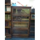 An oak four-section bookcase by Globe Wernicke. WE DO NOT ACCEPT CREDIT CARDS. CLEARANCE DEADLINE IS