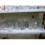 Two shelves of mixed glassware including cut glass spirit decanter and stopper with silver collar