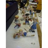 A collection of ten Royal Copenhagen porcelain figures of children at play in various costumes