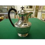 A George V silver hot-water pot with black handle and knop, Sheffield 1933, 17.1 ozt gross WE DO NOT